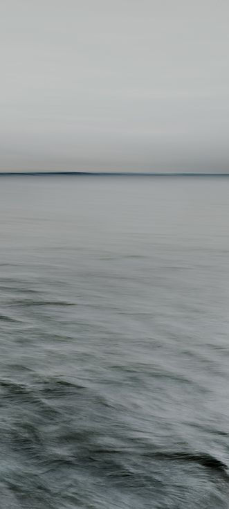 Nadav Kander Horizons III, England, from the series, "Dark Line - The Thames Estuary", 2015 Archival pigment print; printed later 39 1/8 x 17 1/2 in.