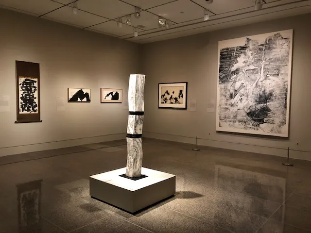 "Monolith" by Kondō Takahiro (b. 1958) displayed with modern paintings, including "An Inexhaustable Treasure" by Munakata Shikō (1903–1975) from the Gitter-Yelen Collection (2023)