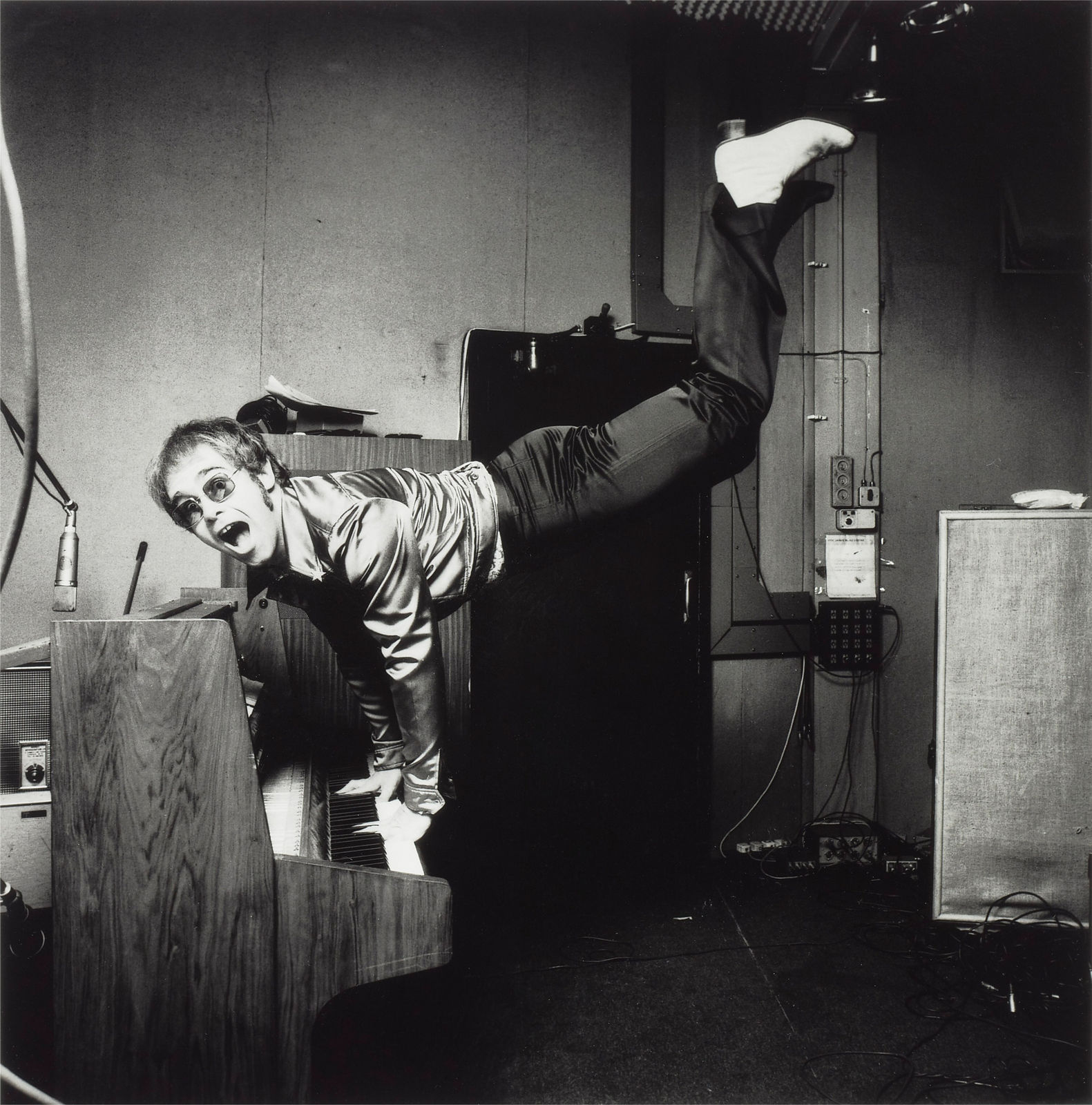 Terry O'Neill, Elton John Performing a Handstand, 1972