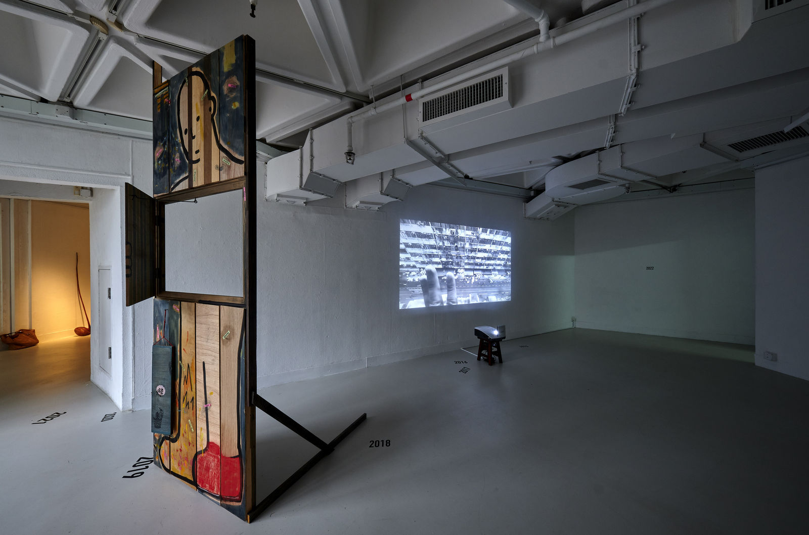 The Present is a Foreign Country (2022) Installation: Single-Channel Video, Acrylics & Charcoal Painting on Plywood, Dimension Variable