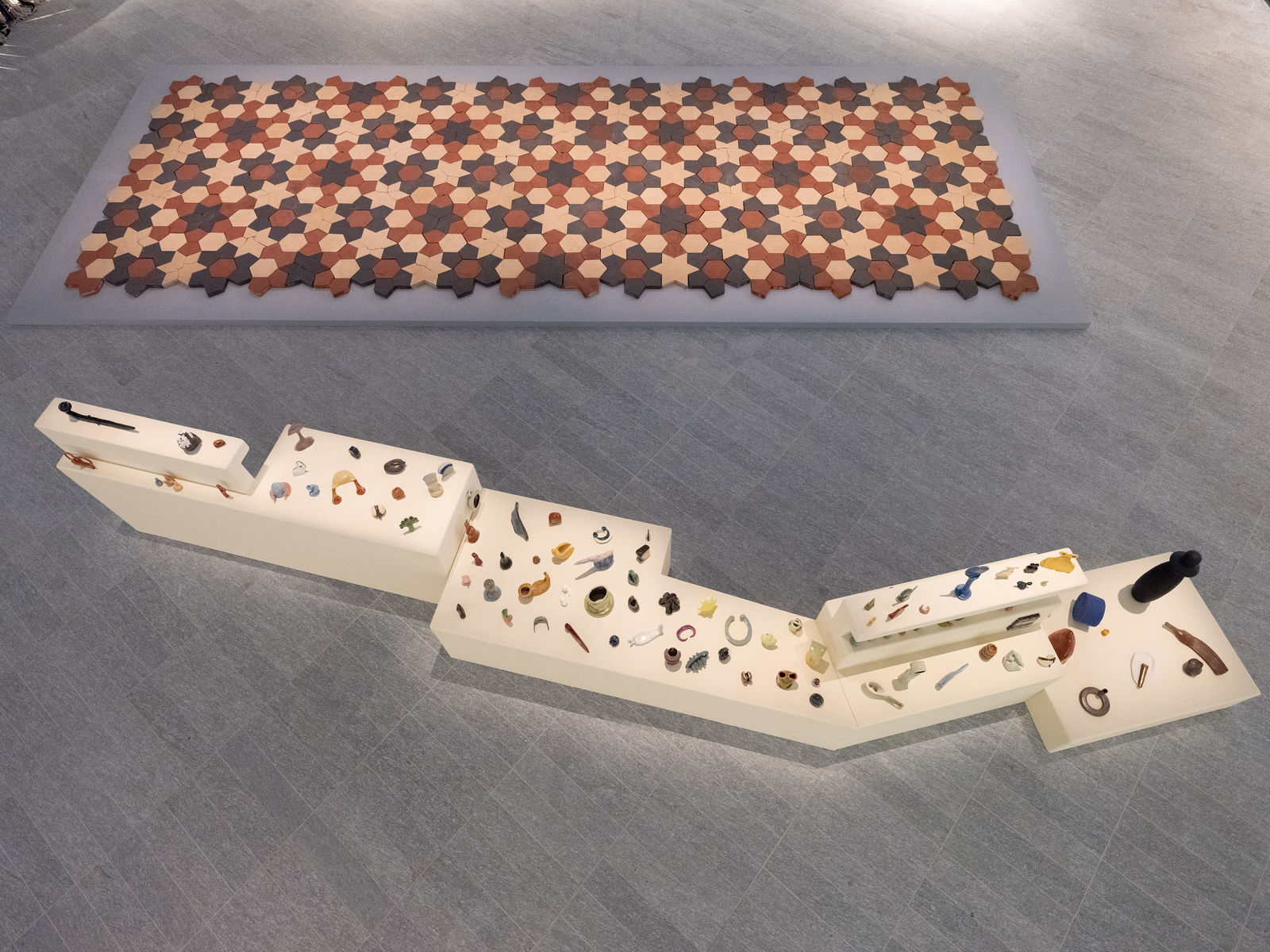 Rand Abdul Jabbar, Earthly Wonders, Celestial Beings, 2019-ongoing Glazed stoneware, dimensions variable (Installation view, Louvre Abu Dhabi, 2022). Courtesy of the Artist.