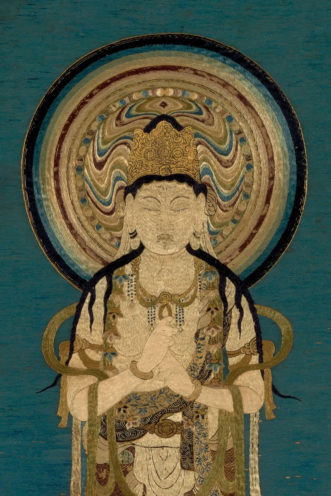 A rare and important embroidered silk icon of Ichiji Kinrin, Kamakura (1185-1333) or Muromachi period (1333–1573), 14th/15th century, the border 15th century