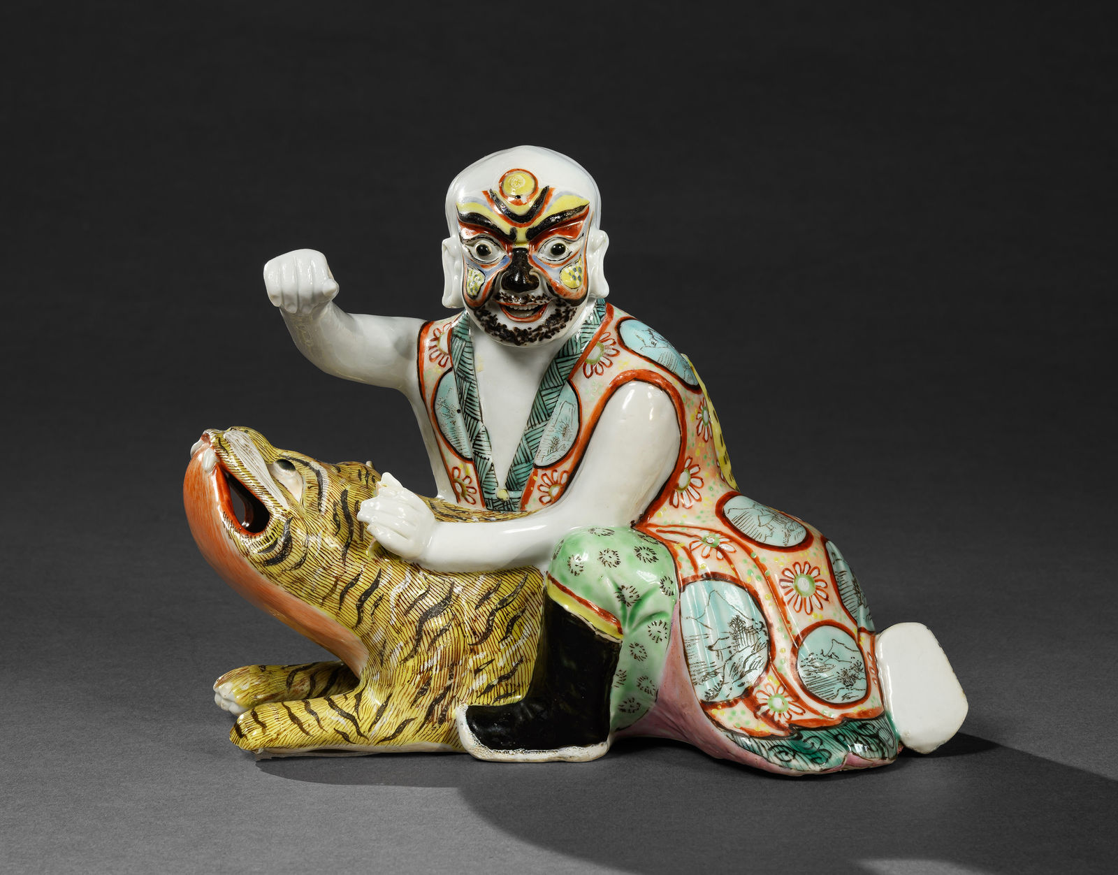 A CHINESE EXPORT FAMILLE VERTE FIGURE OF WU SONG DEFEATING A TIGER, Kangxi Period (1662 - 1722)
