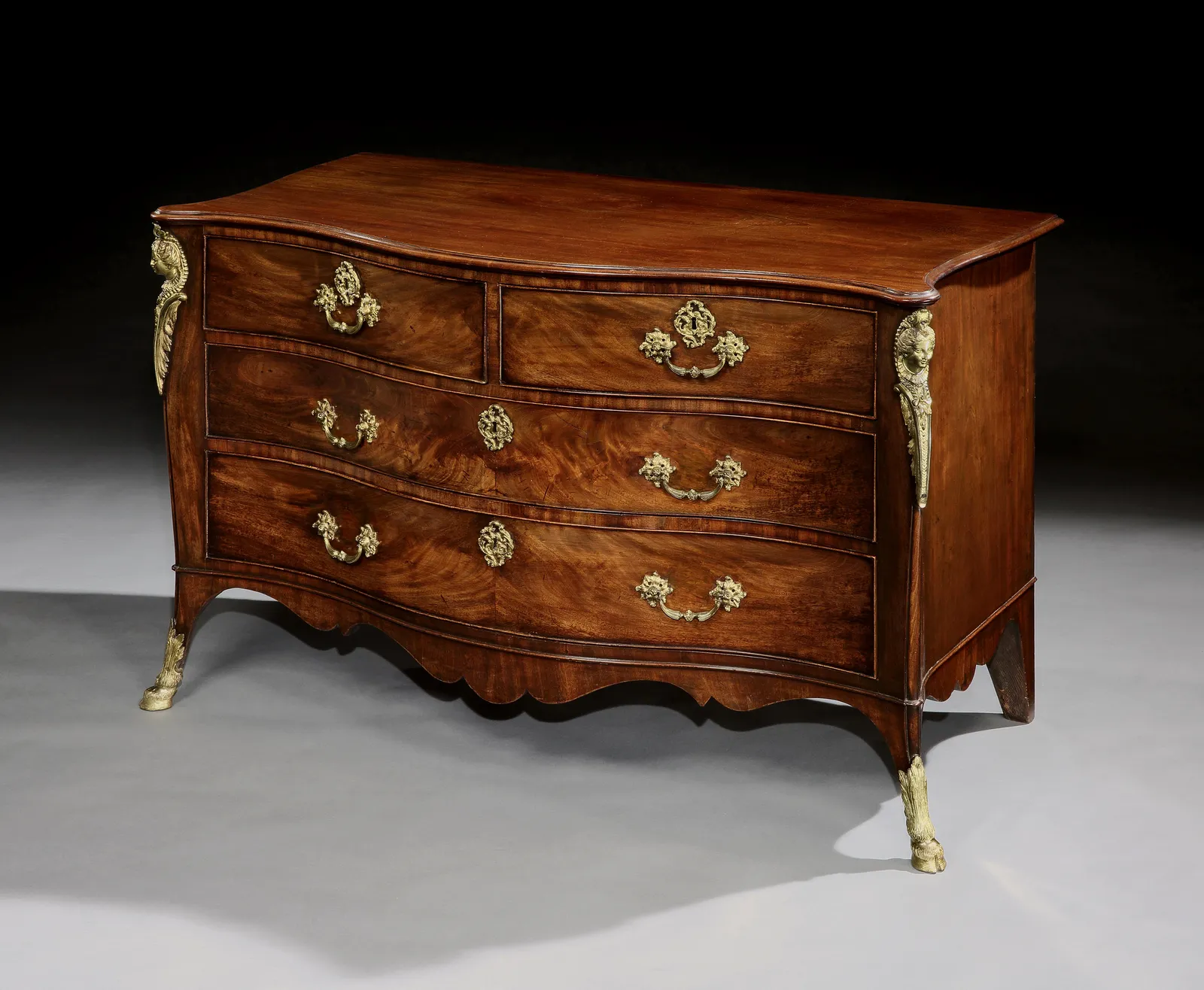 A GEORGE III MAHOGANY COMMODE ATTRIBUTED TO JOHN COBB, ENGLISH, CIRCA 1765