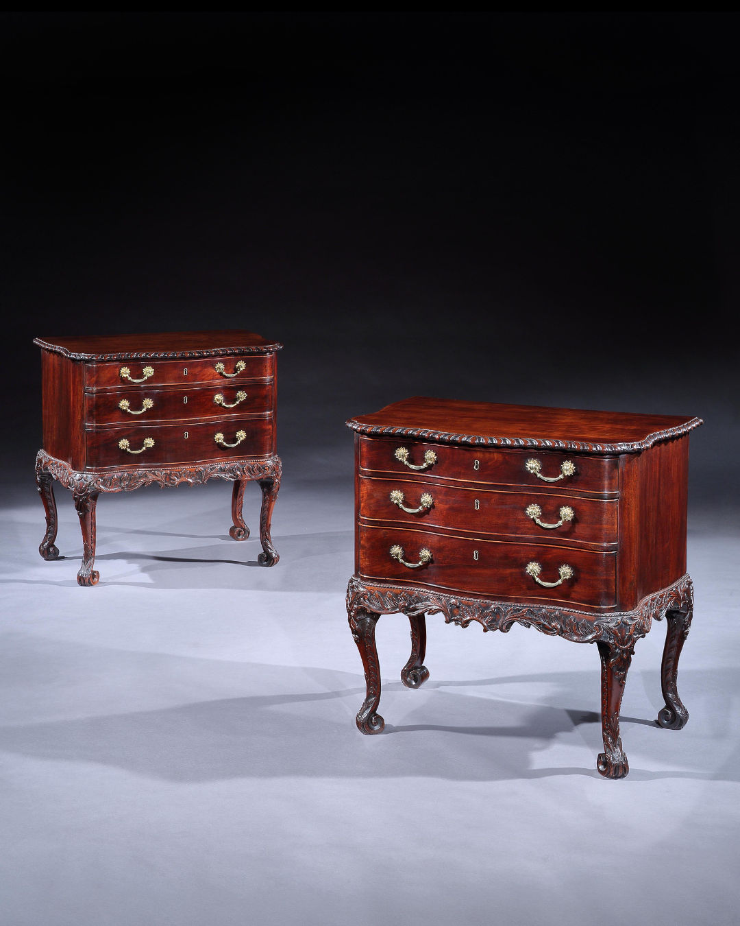 A PAIR OF GEORGE II MAHOGANY COMMODE CHESTS , English, circa 1755