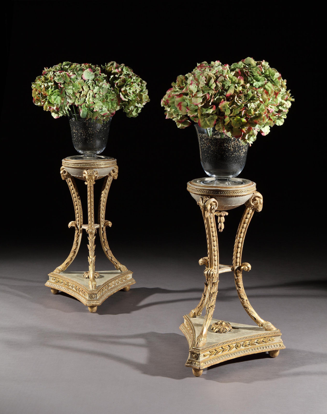 A PAIR OF GEORGE III PARCEL GILT TORCHERES, English, circa 1785
