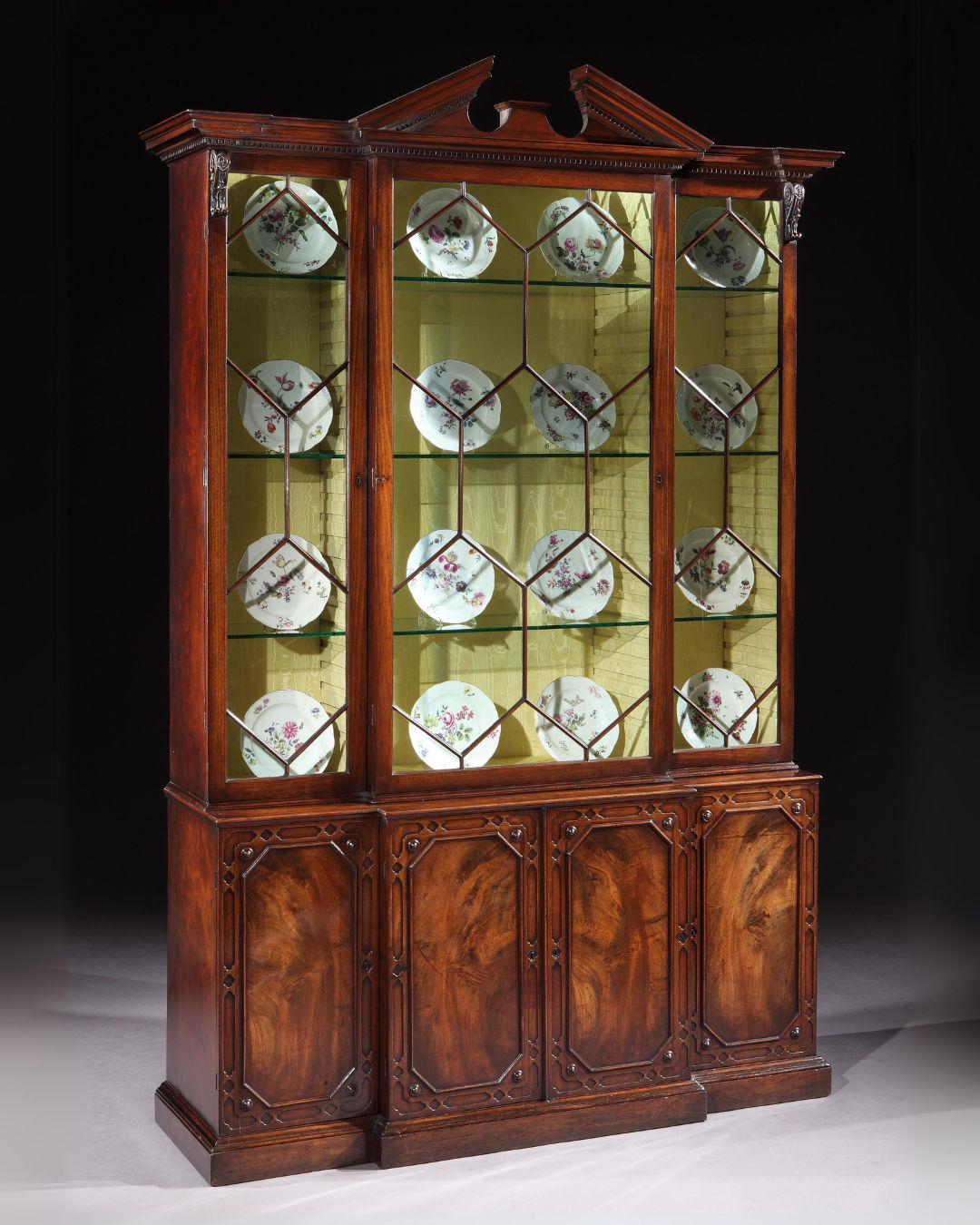 A GEORGE II MAHOGANY BREAKFRONT BOOKCASE, English, circa 1755