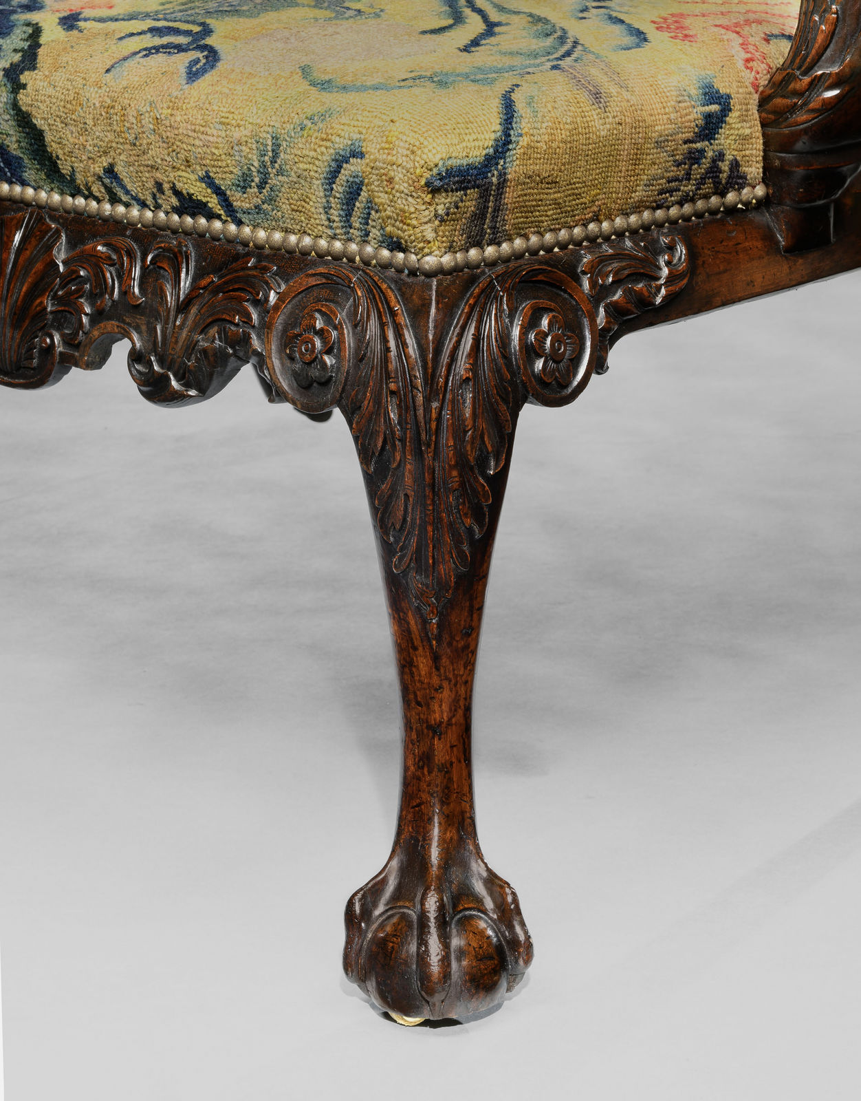 THE PERCIVAL GRIFFITHS RAMSBURY MANOR SETTEE, The settee: English, circa 1750  The associated needlework cover: English, circa 1750