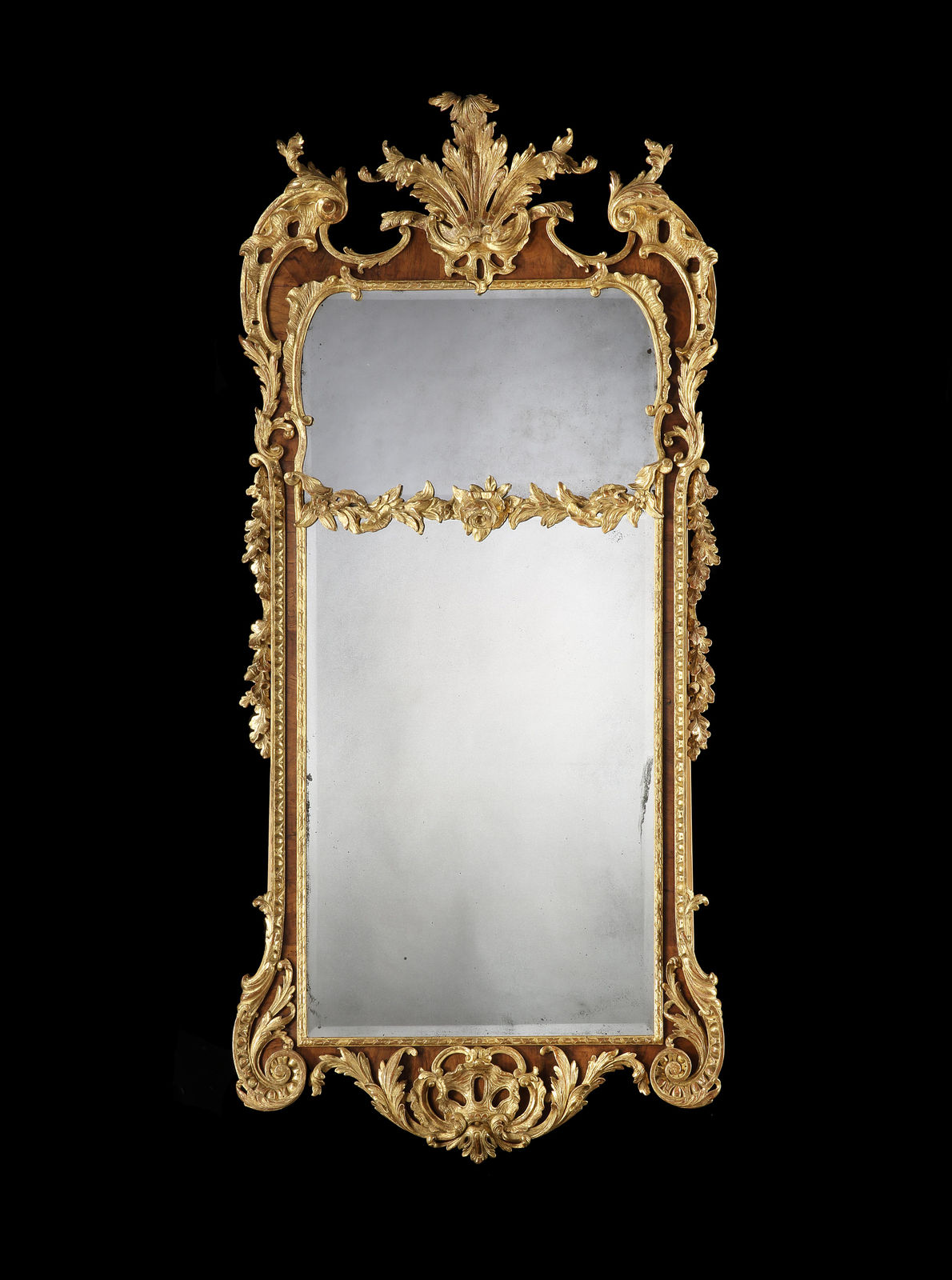 A PAIR OF GEORGE II PARCEL GILT WALNUT PIER MIRRORS, English, circa 1730