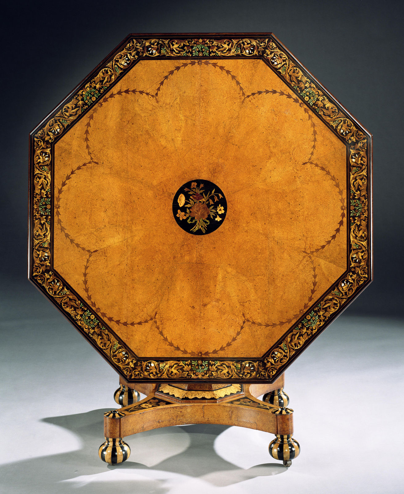 A VICTORIAN INLAID AMBOYNA CENTRE TABLE, English, circa 1860
