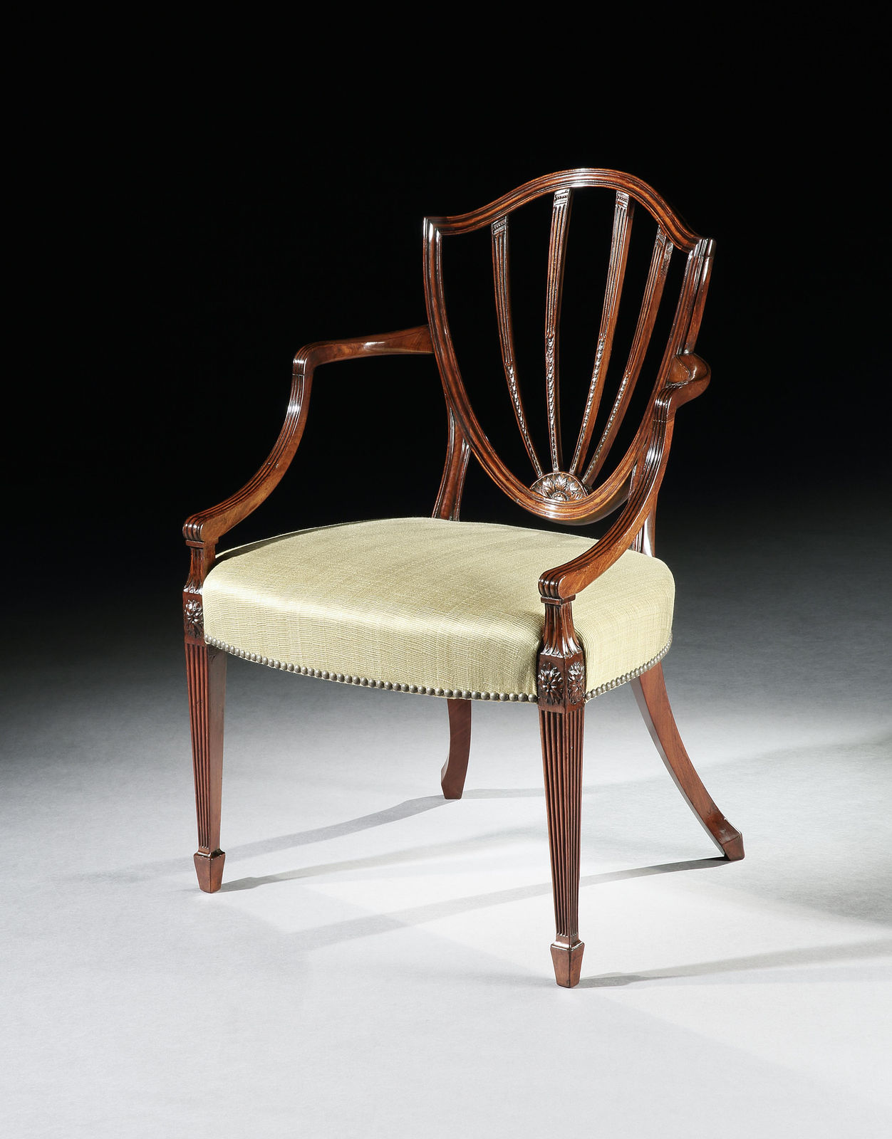 A SET OF SIX GEORGE III MAHOGANY ARMCHAIRS, English, circa 1790