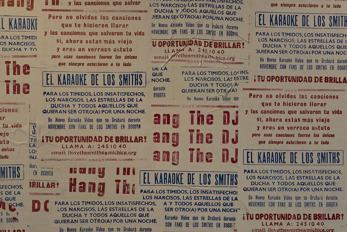 Image of entrance to Phil Collins work at MCA Chicago, walls covered in posters