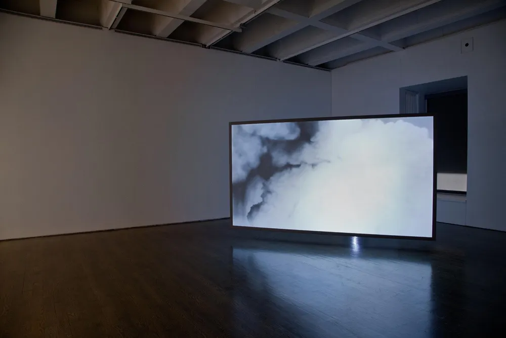 Installation view of Lisa Oppenheim exhibition, cloud projections
