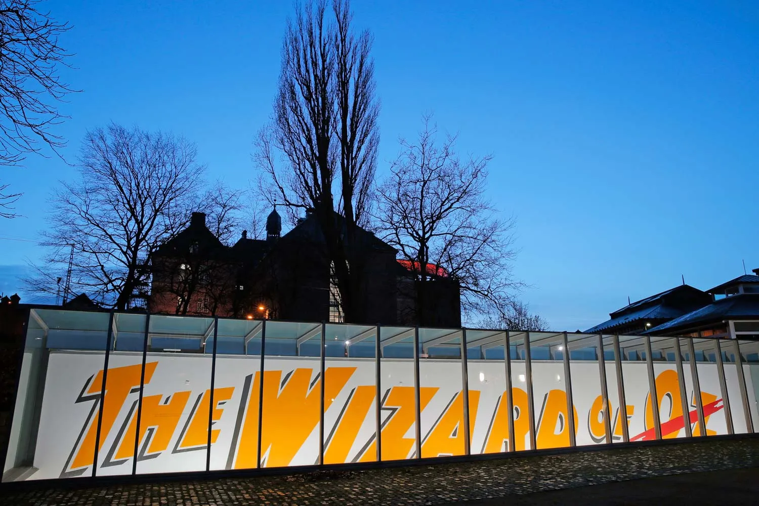 Image of an installation view of Slavs and Tatars - wall installation from outside