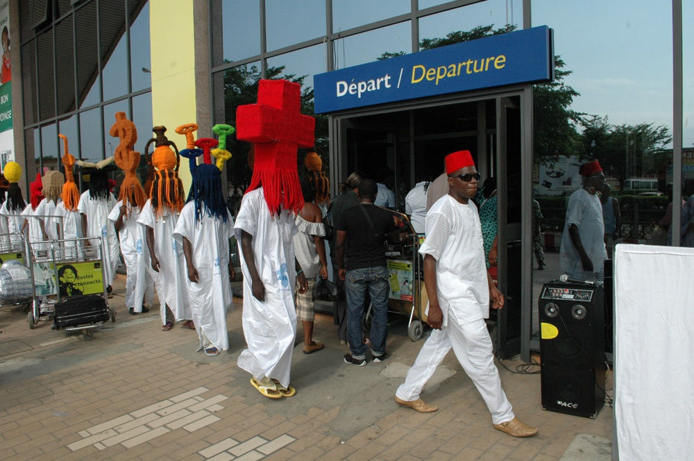 image of processional with people wearing large wigs