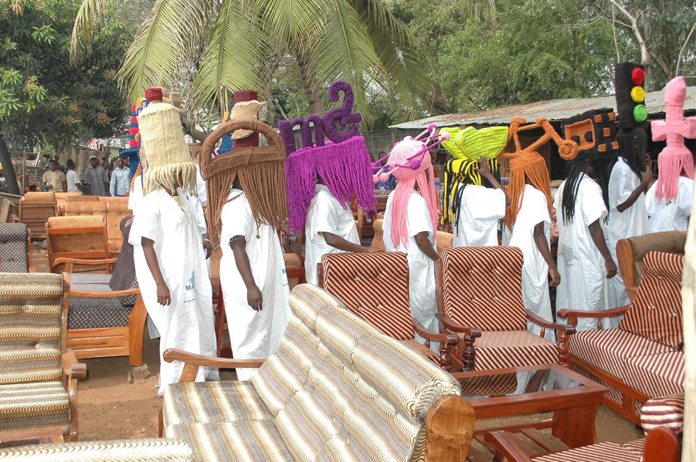 image of processional with people wearing large wigs