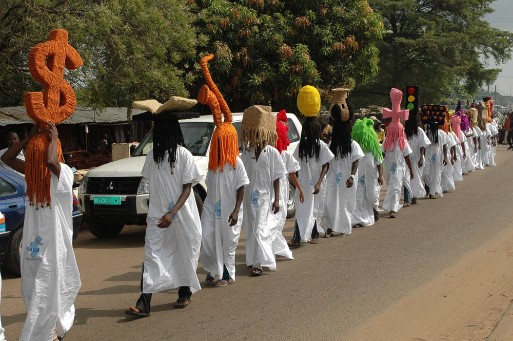 image of processional with people wearing large wigs