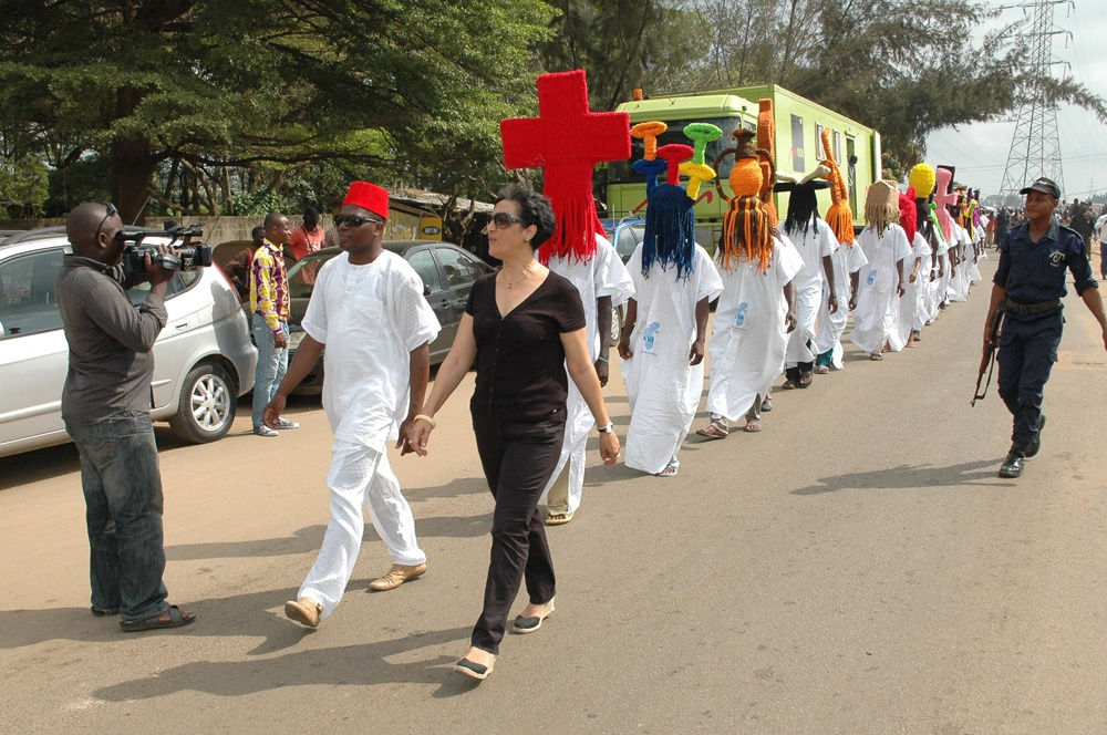 image of processional with people wearing large wigs