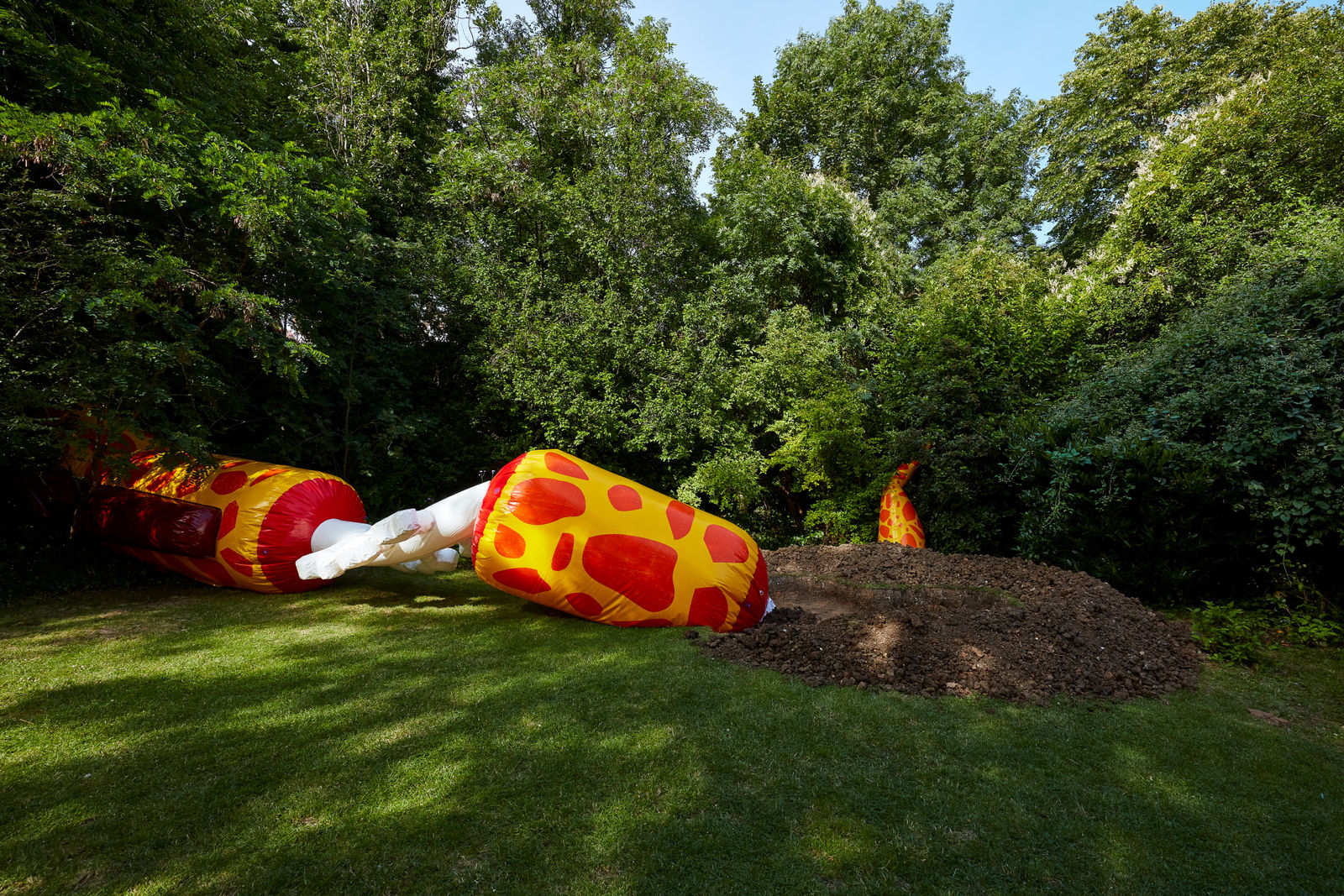 installation view of Wong Ping blow up giraffe