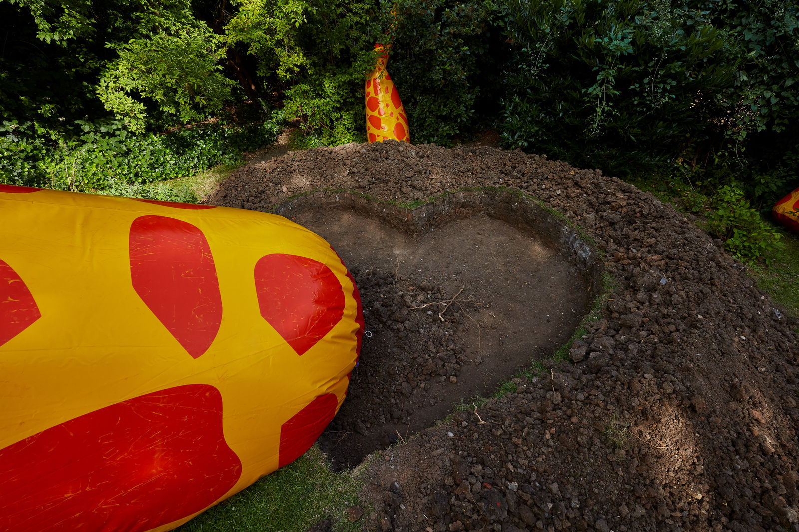 installation view of Wong Ping blow up giraffe