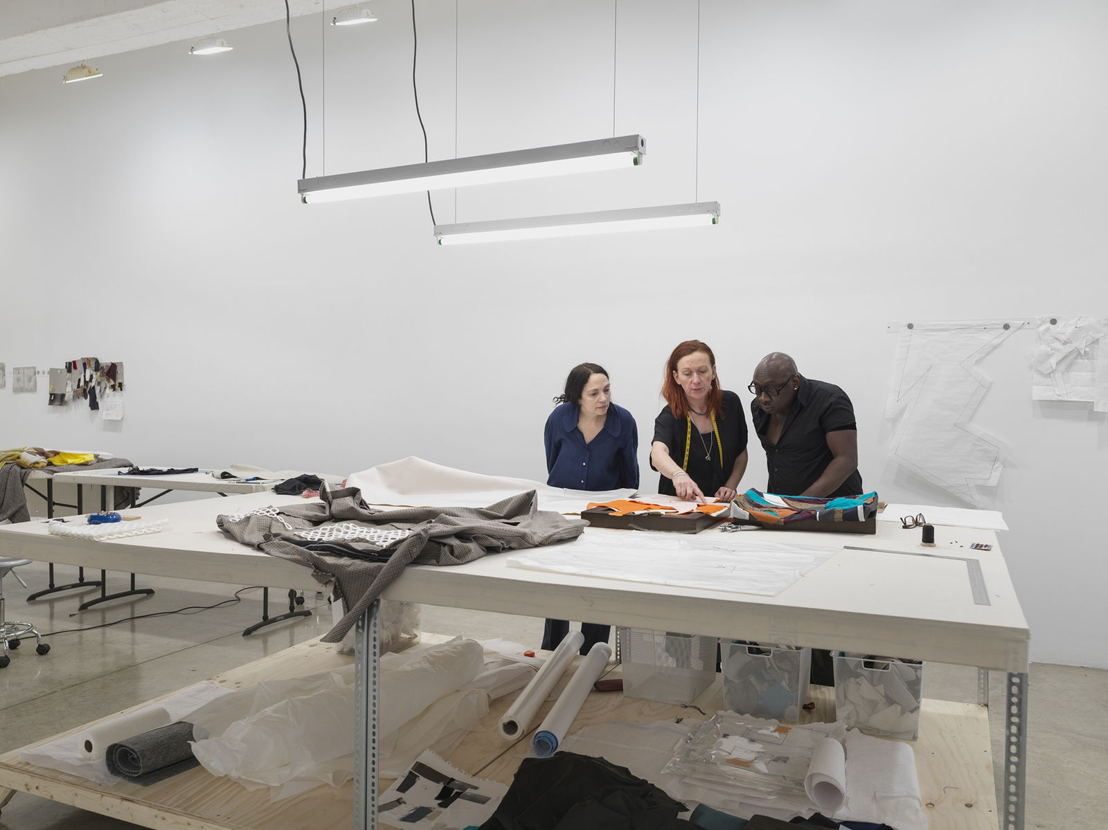 Laura Lima tailor shop install photo - tailors working