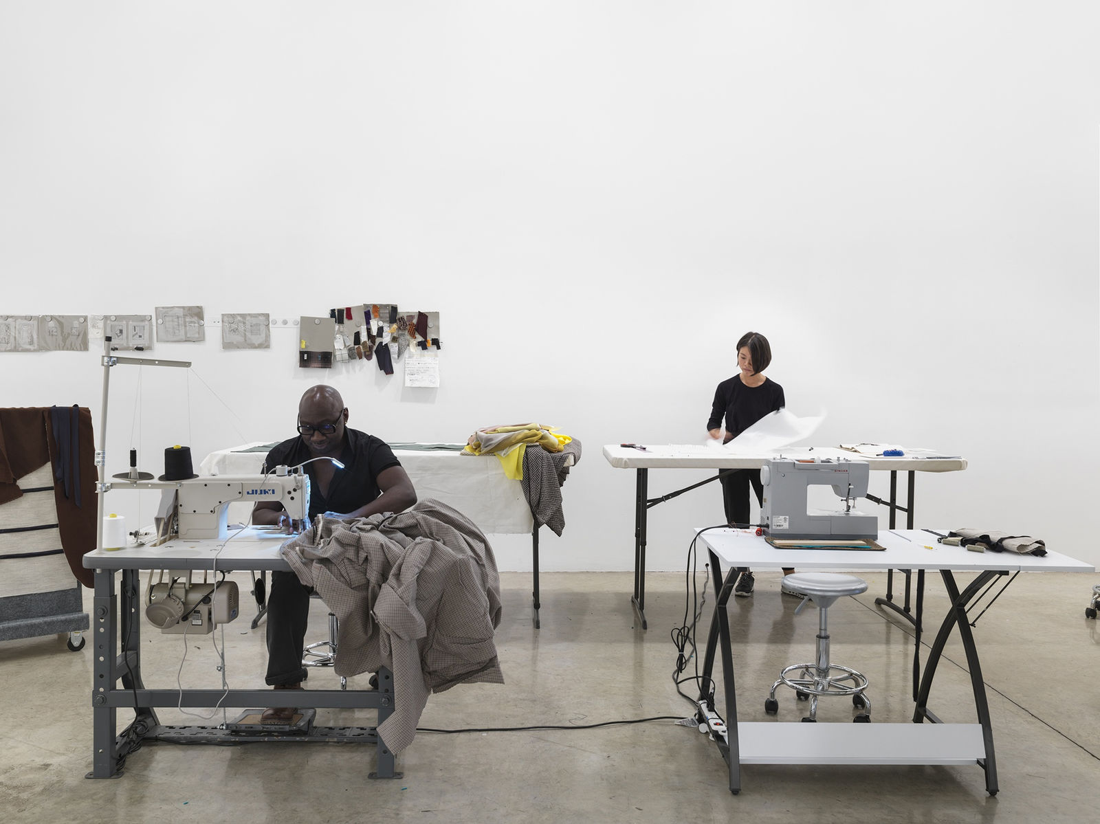 Laura Lima tailor shop install photo - tailors working