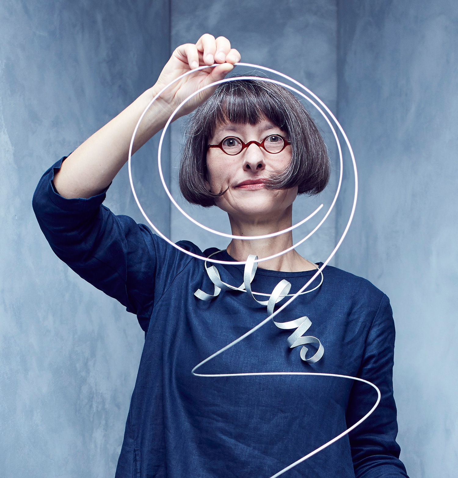 Jewelry artist Ute Decker with examples of her work. Photography Alun Callender