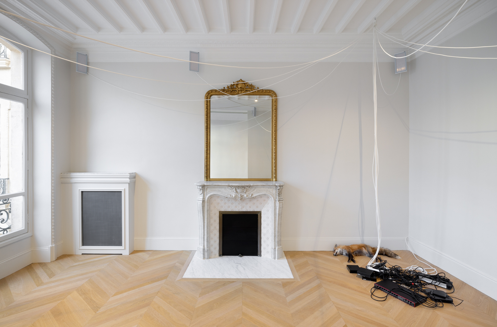 A Parisian room with artworks in it