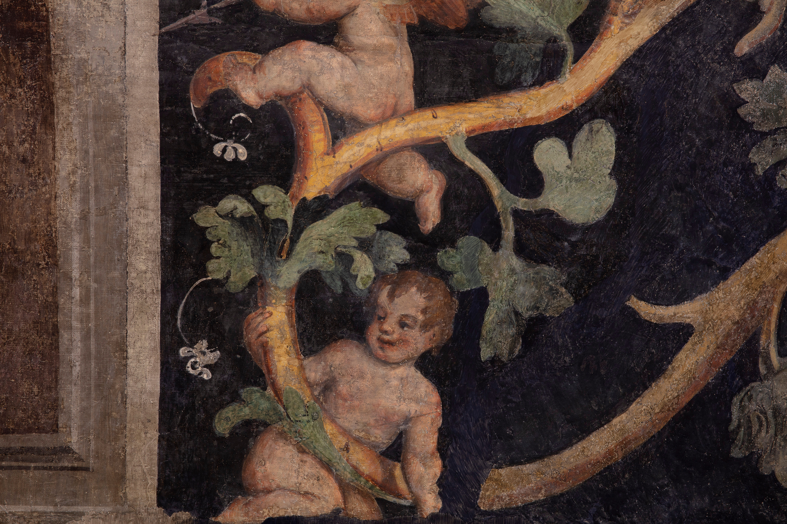 detail of a fresco depicting grotesques and the god Mars