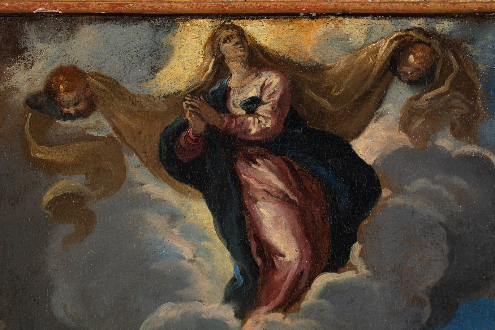 Detail of an oil painting of the assumption of the Madonna.