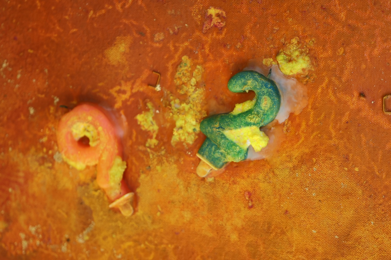 Close up of Sir Frank Bowling's 92nd birthday candles in a painting in progress