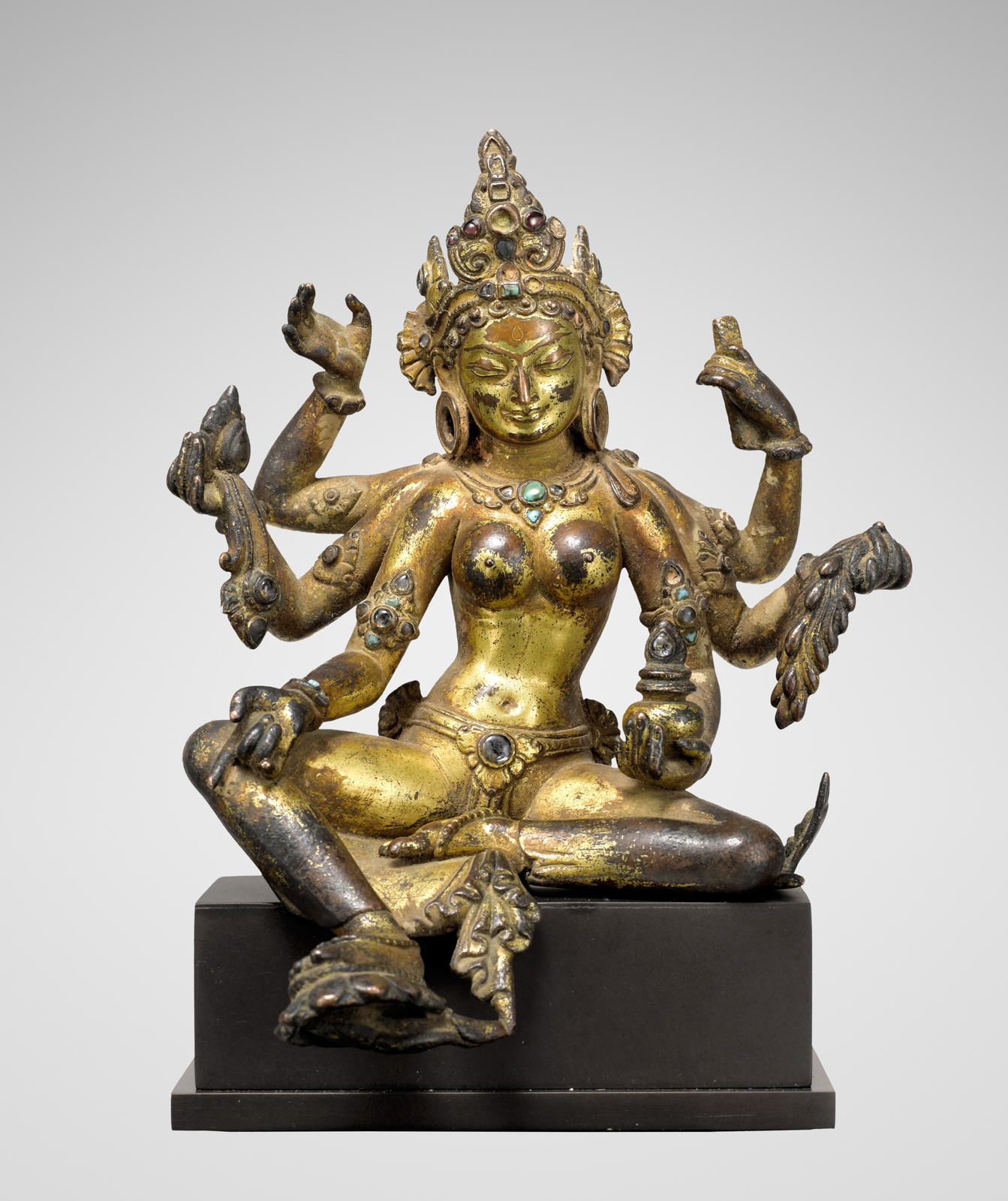 This luminous image of Vasudhara, the Buddhist goddess of wealth, fertility, and spiritual abundance, embodies the refined elegance and devotional intimacy characteristic of medieval Nepalese sculpture.