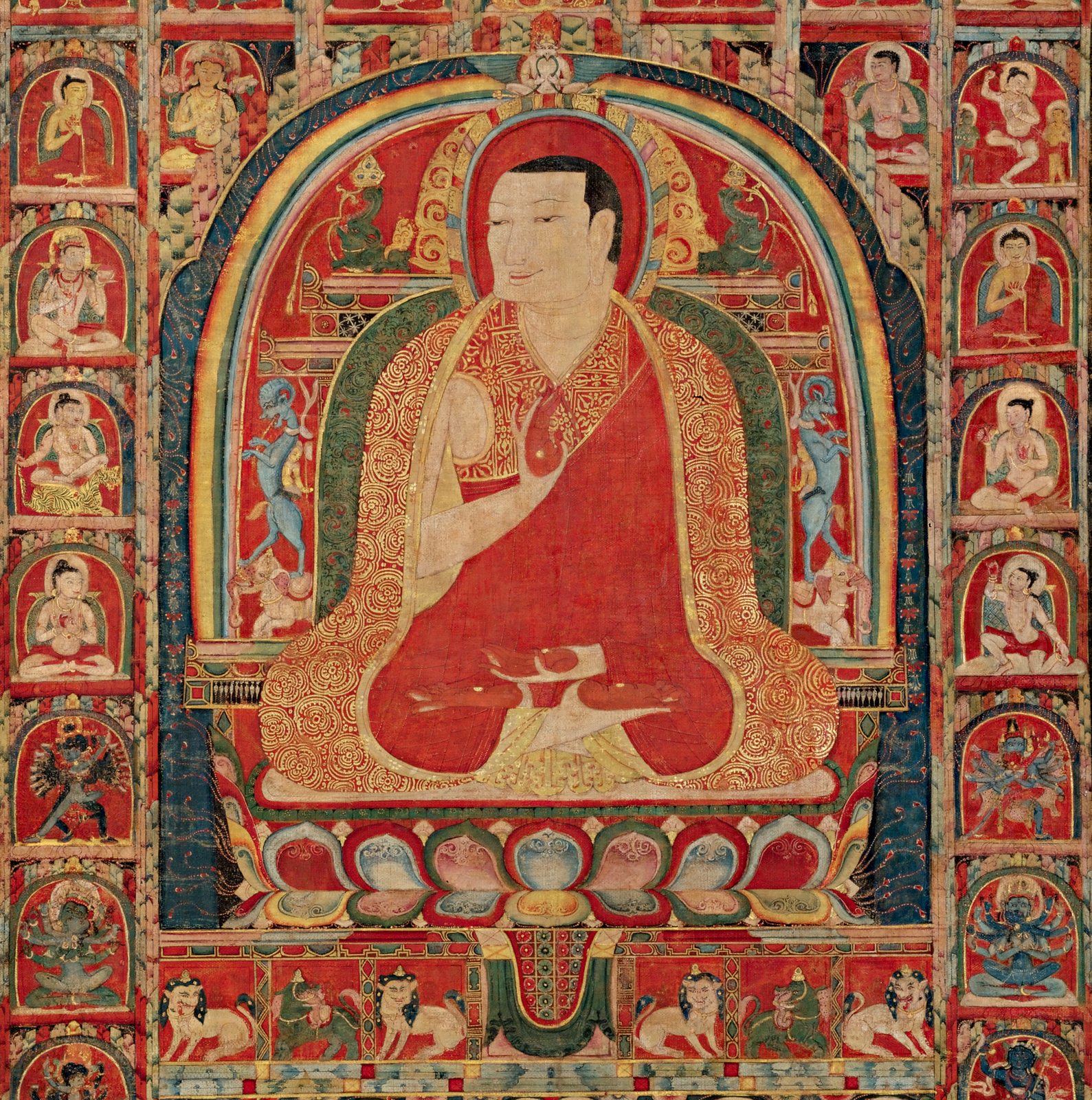 THE Abbot is depicted seated in the lotus position with his hands in abhaya mudra, signifying protection and overcoming fear.  