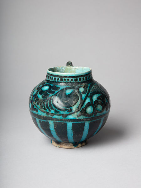 <span class="title"><em>A 'silhouette-ware' jug with turquoise glaze over clay slip, Iran, probably Kashan</em>, c. 1180-1200</span>