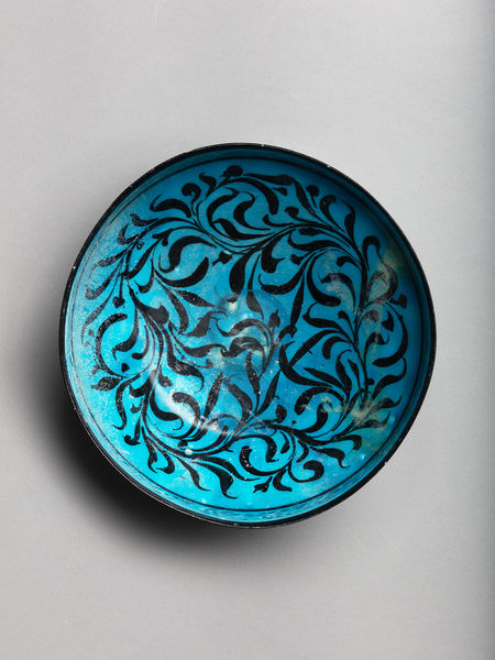 <span class="title"><em>A bowl with ‘water-weed’ design and perforated frieze under turquoise glaze, Iran, probably Kashan</em>, c. 1200-1220</span>