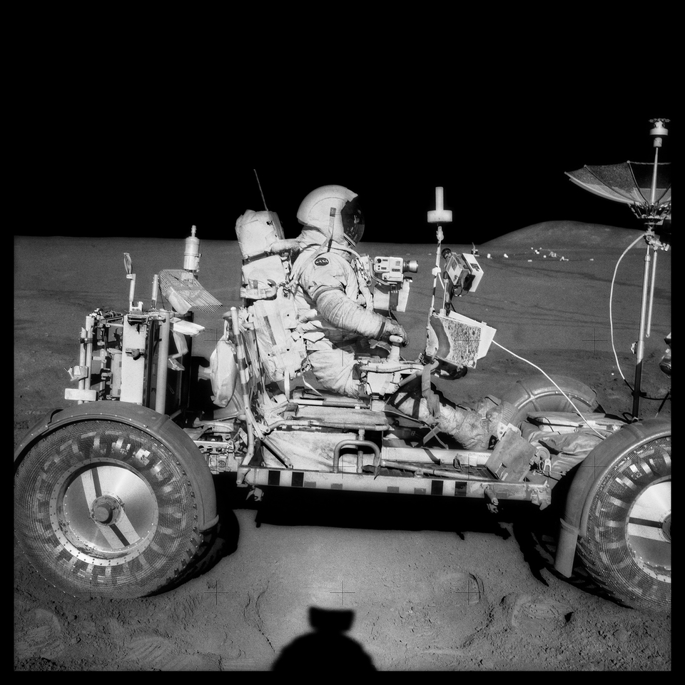 David Scott Drives the First Lunar Rover; Note Aerial Navigation Photographs;, Photographed by James Irwin, Apollo 15, July 26-August 7, 1971