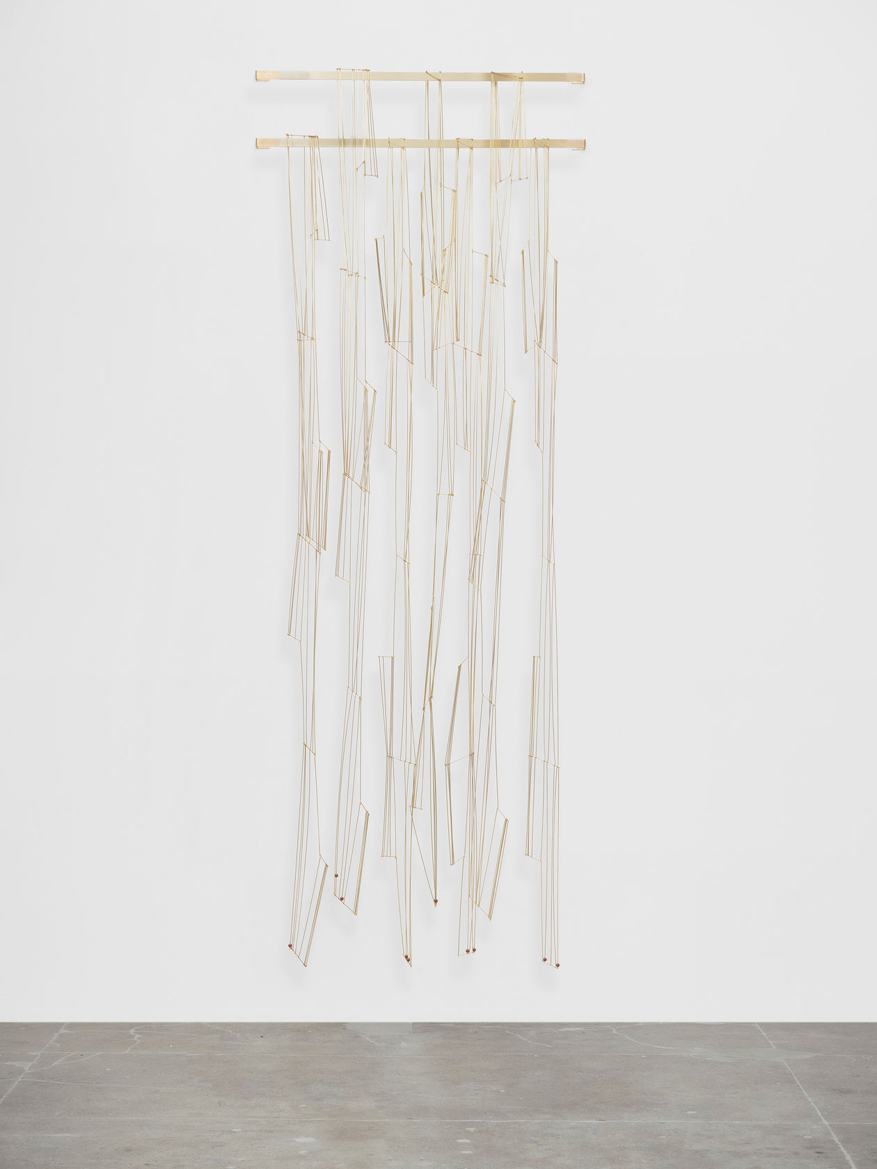 Leonor Antunes discrepancies with W.W. #12, 2025 Brass, acrylic beads Dimensions variable Laid flat dimensions left to right: a. 173x5'...