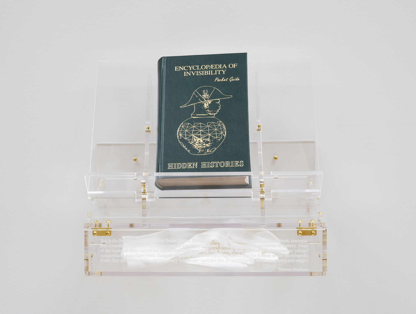 Tavares Strachan Encyclopedia of Invisibility (Pocket Guide), 2024 Leather, gilding, archival paper, lucite box and stand 9 1/4 x 12...