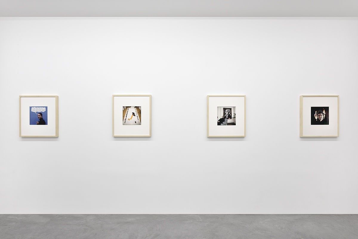 4 framed artworks hang in a gallery.