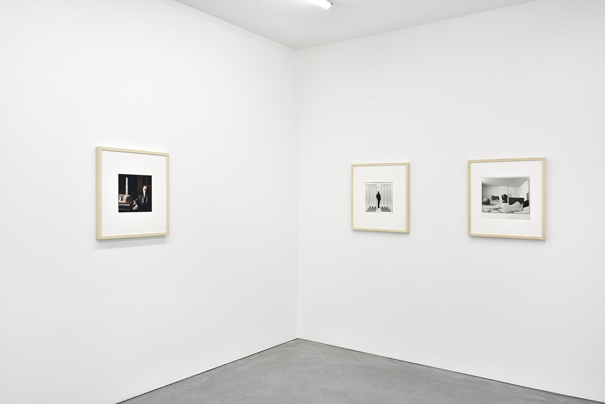 3 framed artworks hang in a gallery.