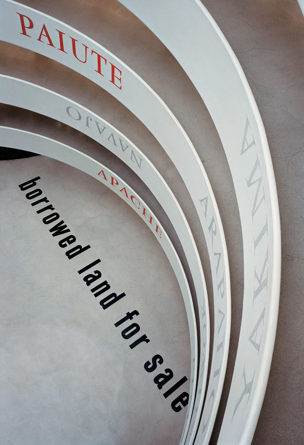 Partial aerial view of text-based installation by Lothar Baumgarten in Guggenheim rotunda.