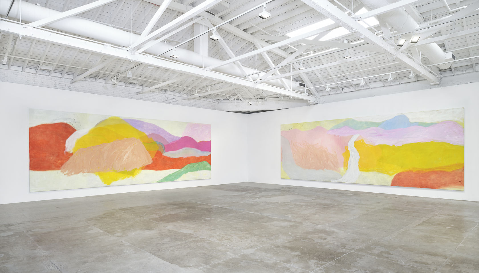 Two large landscape paintings by Jongsuk Yoon hanging in a white gallery space