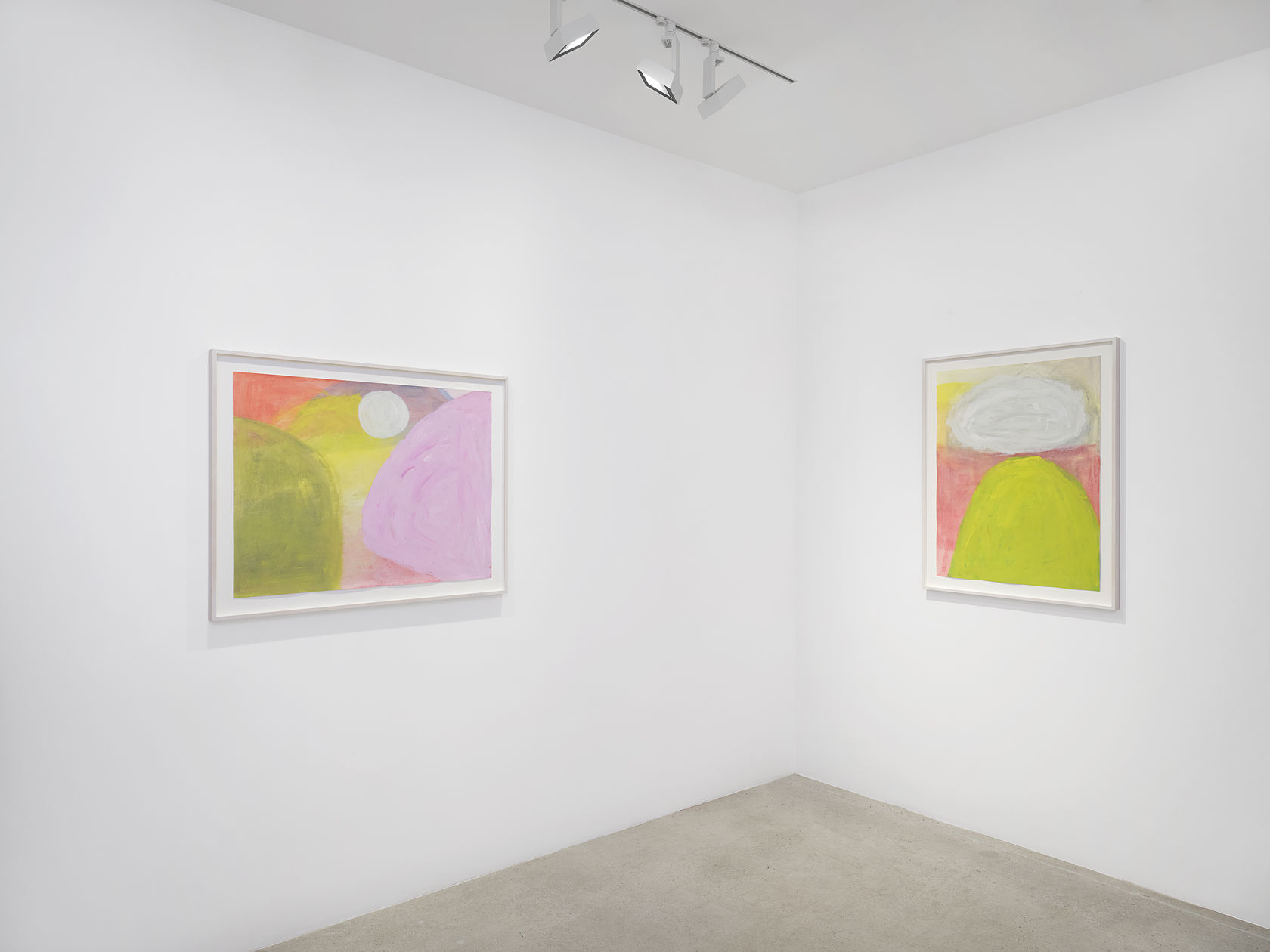 Two colorful landscape paintings in white frames by Jongsuk Yoon in white gallery space