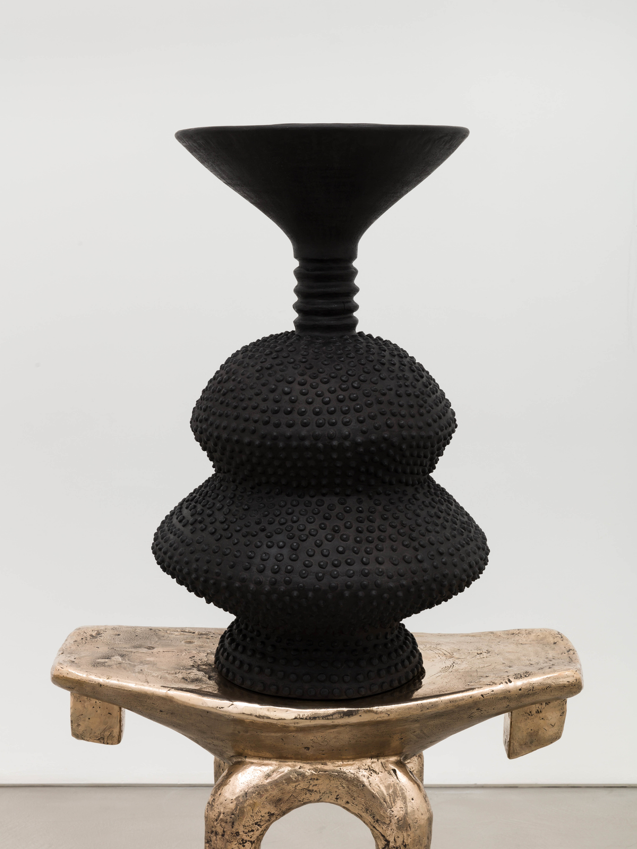 Lina Iris Viktor, black eclipse on golden stool, 2024