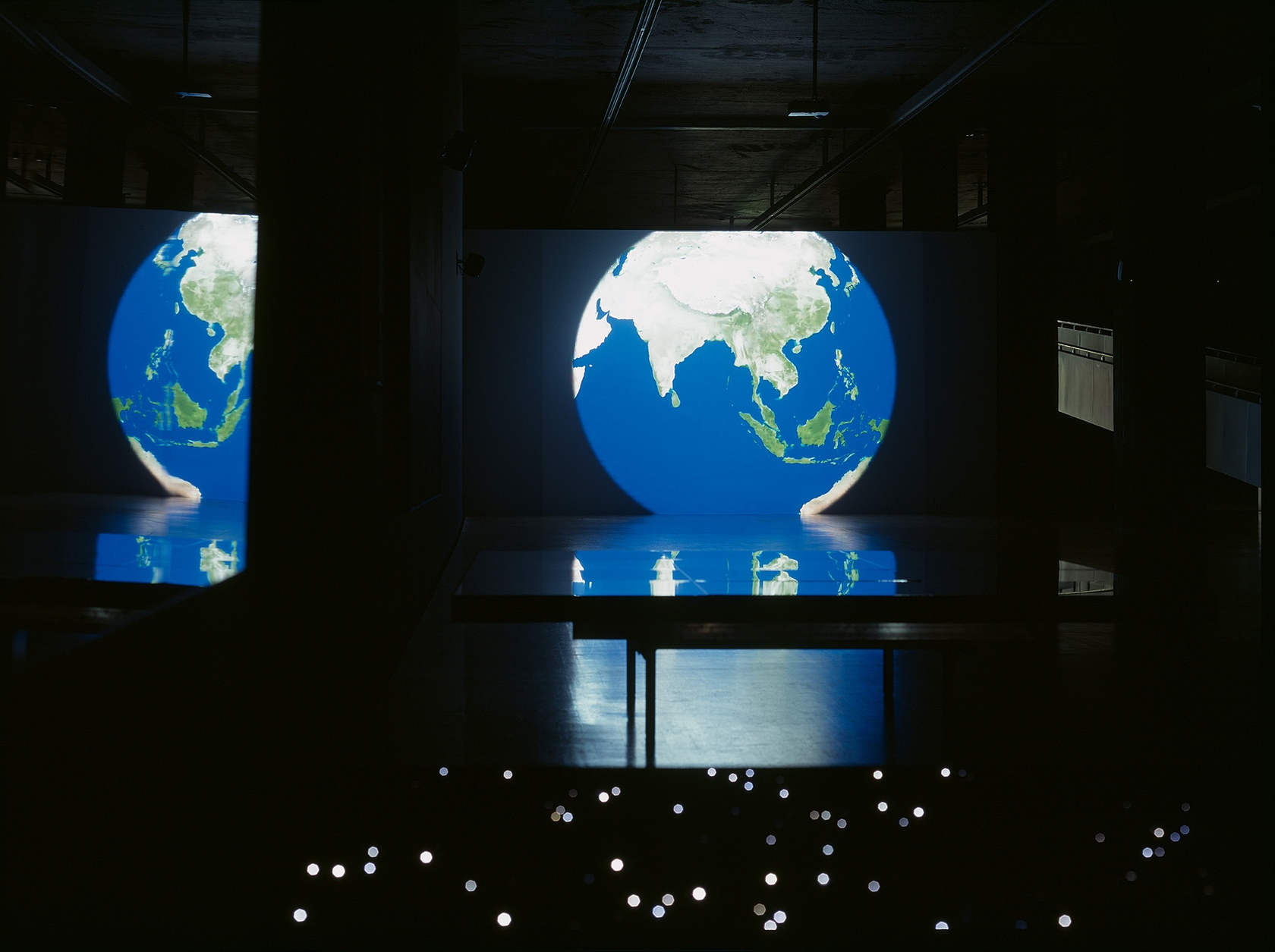 Last Year Again, 2008 Synchronized double projection, digital video animation 3&acute;06&acute;&acute; Projected on two sides of a freestanding rectangular wall...