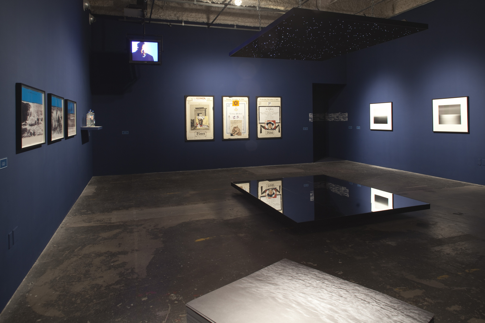 Night Sky: Mars from Venus: 12, 2007 (on ceiling and floor) Grid of 12 squares, preshrunk neoprene, aluminium and black...