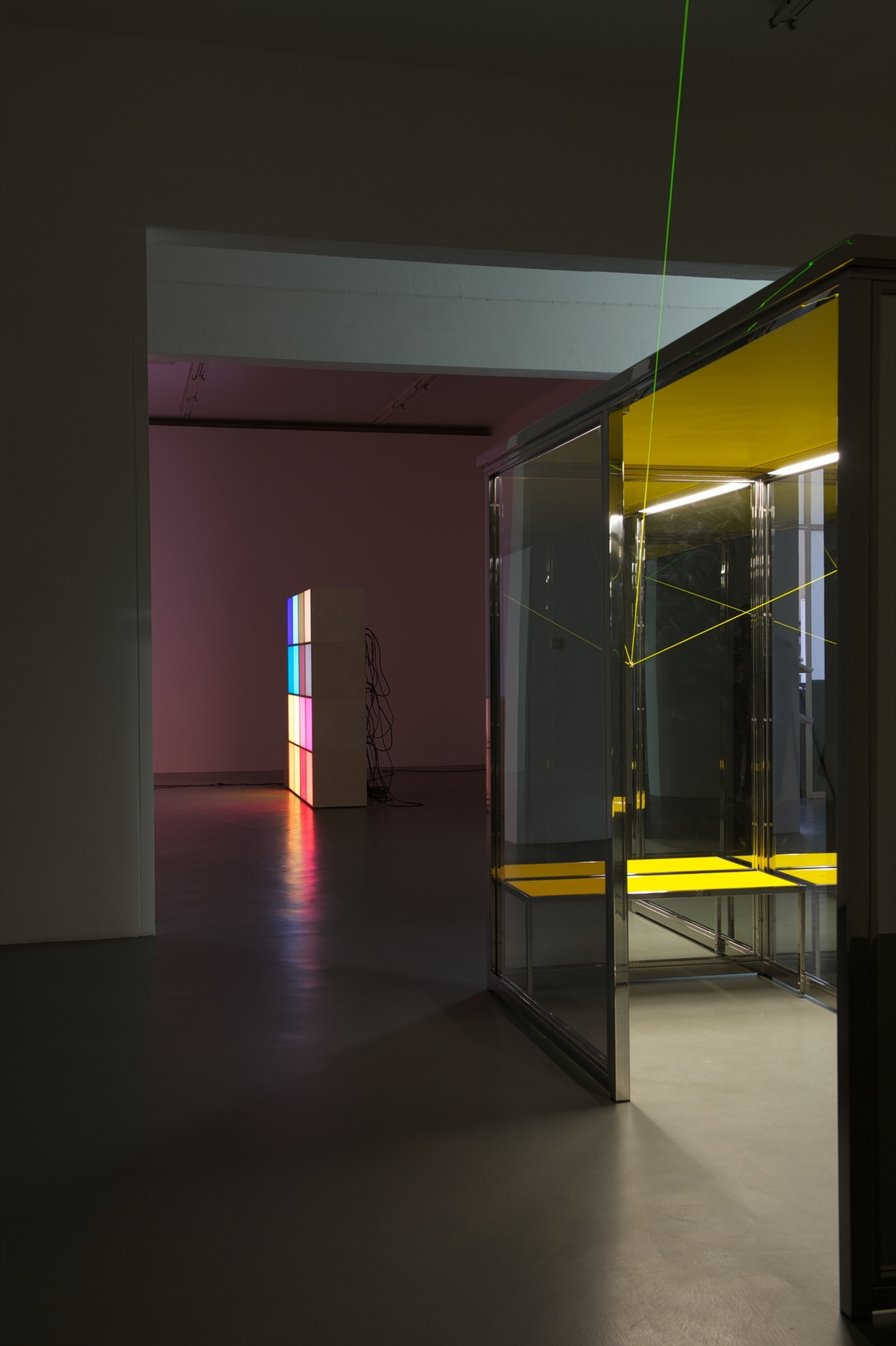 Vanishing Waiting Room, 2008 6 polished stainless steel tubes, 2 one-way mirrors, 2 two-way mirrors, yellow MDF roof, yellow bench,...