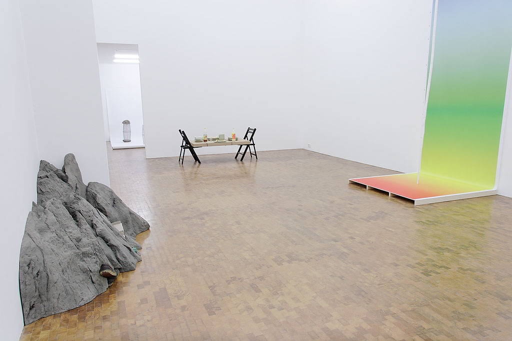 Quarry cast between a given corner and three random items, 2007 (left) Stone cast, shoes, taperole, cardboard box An illusory...