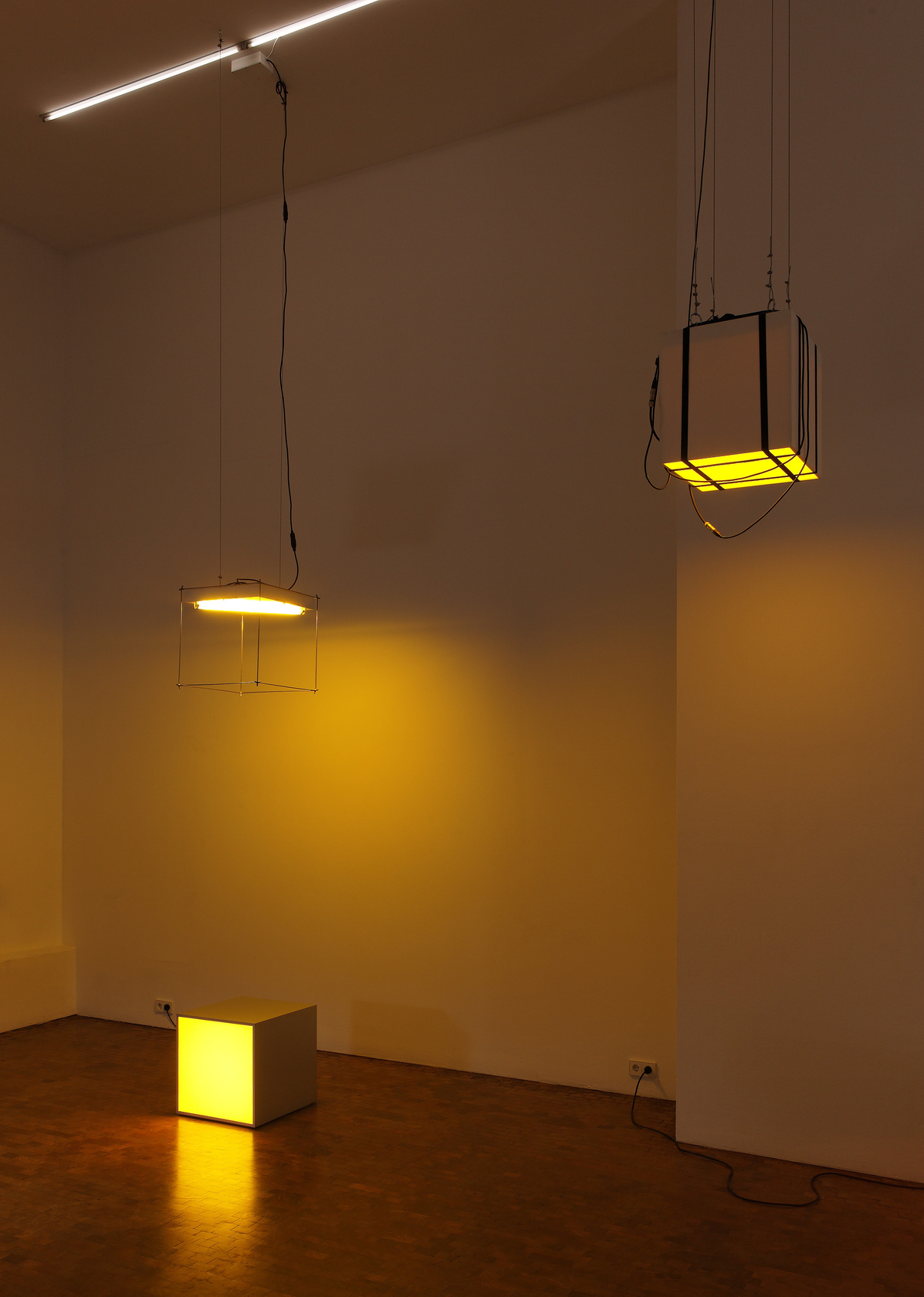 International Aluminium Double Cube Triangle - Yellow, 2010 (left) Aluminium Pixel box with yellow lamps, wire cube frame, Pixel box...