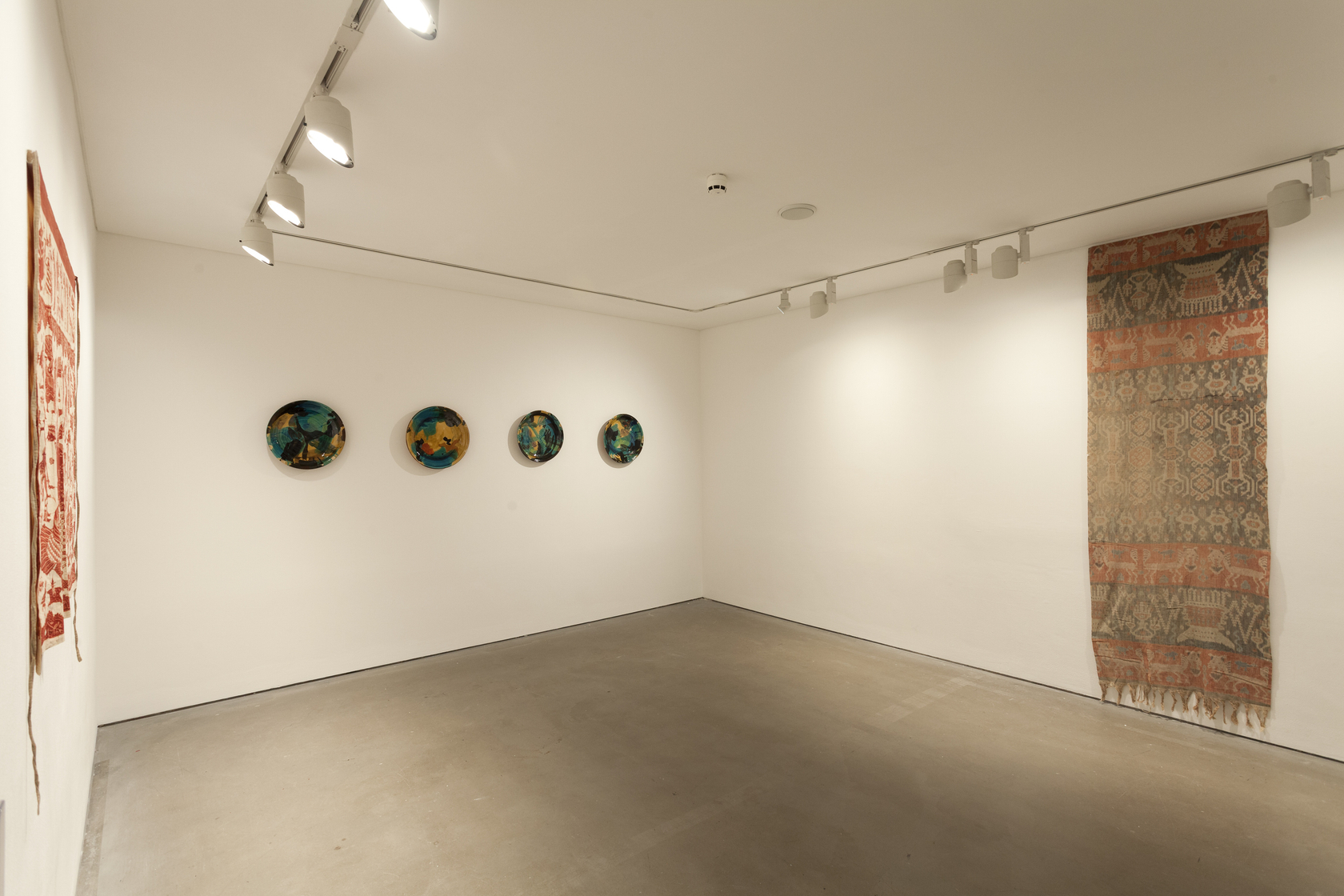 Untitled, 2012 (center) Pottery In collaboration with Philip and Frannie Leach Textile from the collection of Rudolph Smend (left) Textile...